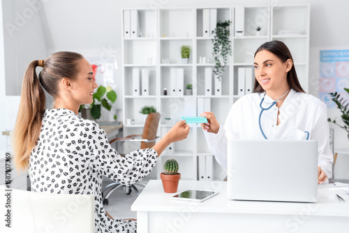 Female gynecologist giving ...