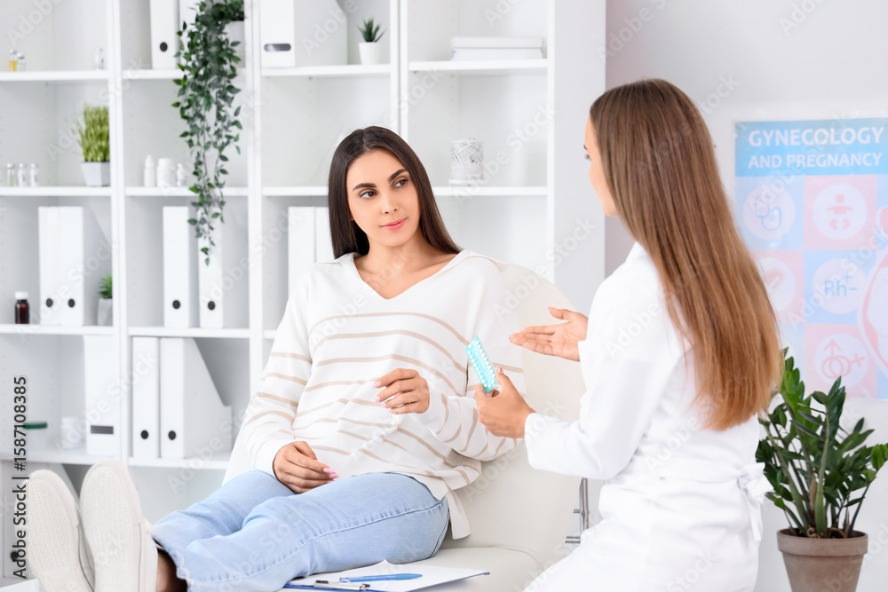 Fototapeta premium Young woman visiting gynecologist in clinic