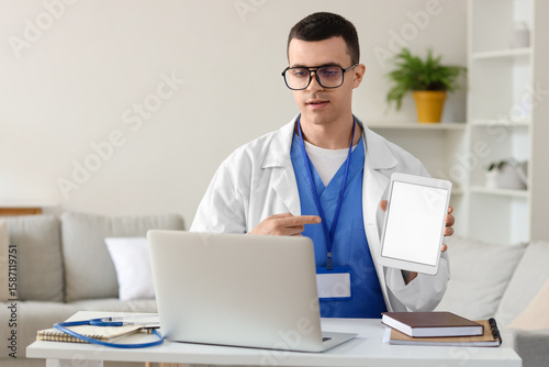 Young doctor video chatting...