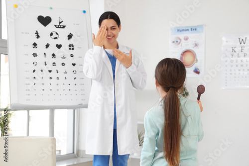 Little girl with occluder a...