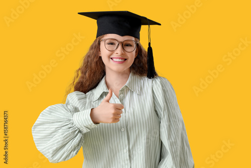 Happy female student in gra...