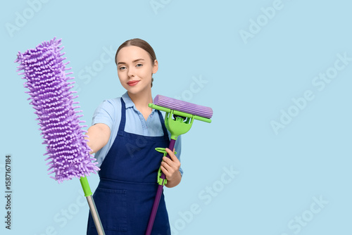 Young woman with floor mops...