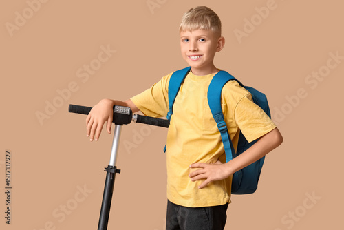 Cute schoolboy with modern ...
