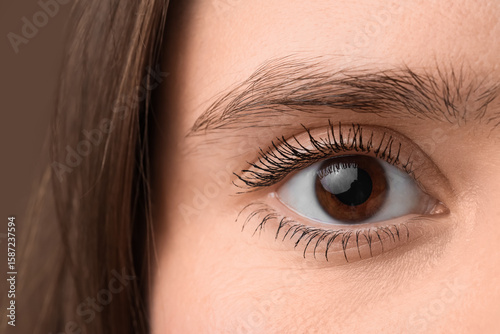 Woman with brown eyes on co...