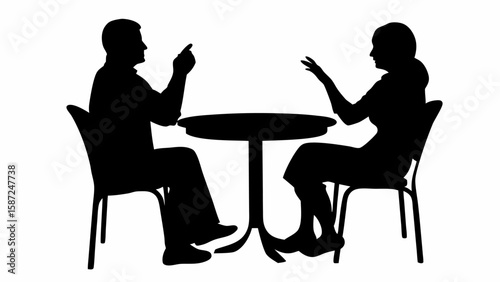 Silhouette of man and woman sitting at a round table in discussion with hand gestures and chairs shown
