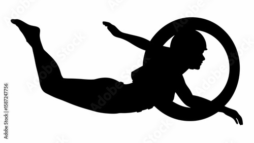 Silhouette of a person diving through a hoop with outstretched limbs in a dynamic pose against white