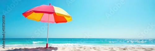 Vibrant Beach Umbrella Sunny Shade on Sandy Shore, Perfect for Summer Vacation Imagery