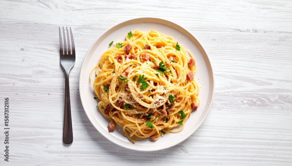 A plate of spaghetti carbonara, garnished with parsley, sits next to a fork. A plate of spaghetti carbonara, garnished with parsley, sits next to a fork.