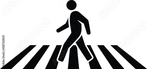 A black silhouette of a person walking across a black and white crosswalk lines