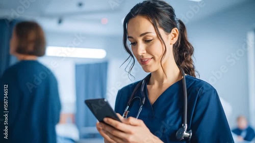 Dedicated young nurse using smartphone for research in modern hospital setting
