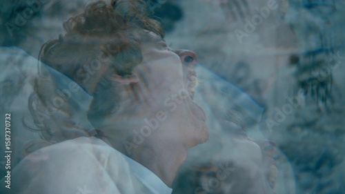 Frustrated male patient emotionally screaming during psychotic episode in mental hospital ward with flickering light. Kaleidoscope effect