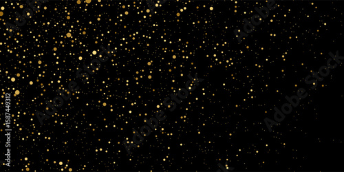 Gold glitter texture on a black background. Holiday background. Golden explosion of confetti. Golden grainy abstract texture on a black background. Design element