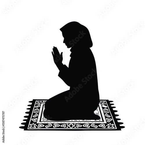 Woman praying on patterned rug kneeling hijab