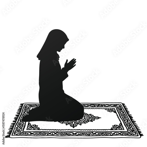 Black silhouette of a woman praying on a rug kneeling prayer mat