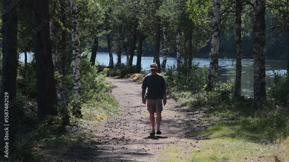 Are, Sweden A man walks on a dirt path near the Åre River. Are, Sweden A man walks on a dirt path near the Åre River.