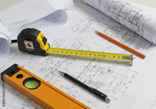 Engineering project in progress with technical drawings, measuring tape, spirit level, and drafting tools.