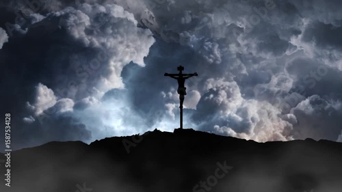 jesus cross silhouette on top of mountain
