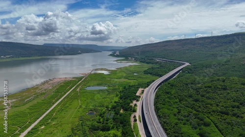 The M6  motorway Nakhon Ratchasima Province - Bang Pa-in. Lam Ta Khong River and Mountain. Drone shot of scenic landscape rural place traffic. Motorway Korat