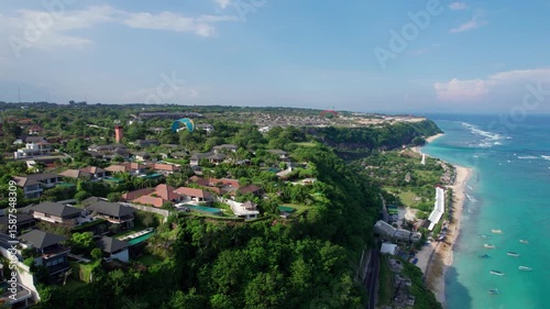 Cliffside Villas and Paragliders Over Melasti Beach in Bali – Aerial View