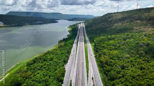 The M6  motorway Nakhon Ratchasima Province - Bang Pa-in. Lam Ta Khong River and Mountain. Drone shot of scenic landscape rural place traffic. Motorway Korat