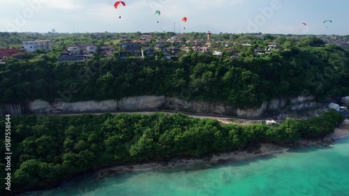 Cliffside Villas and Paragliders Over Melasti Beach in Bali – Aerial View