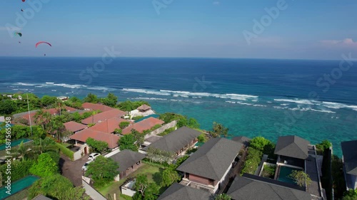 Cliffside Villas and Paragliders Over Melasti Beach in Bali – Aerial View