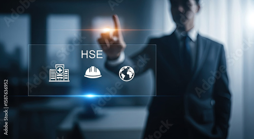 HSE Concept: Businessman touching virtual screen with health, safety, and environment icons. Modern technology for workplace safety compliance.