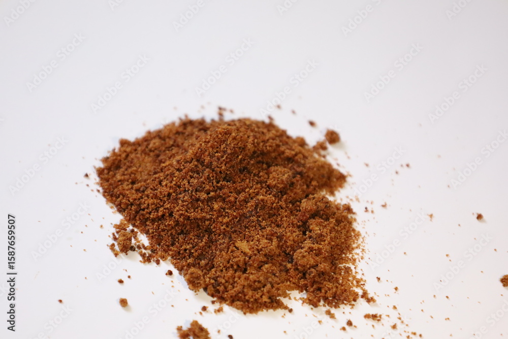 Scattered piles of brown sugar Scattered piles of brown sugar