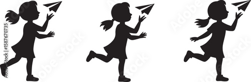 Girl releasing paper airplane silhouette child