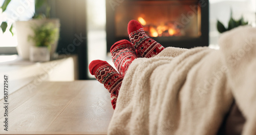 Tableau sur toile Christmas, cozy socks and feet of people in home for vacation break, festive season and bonding