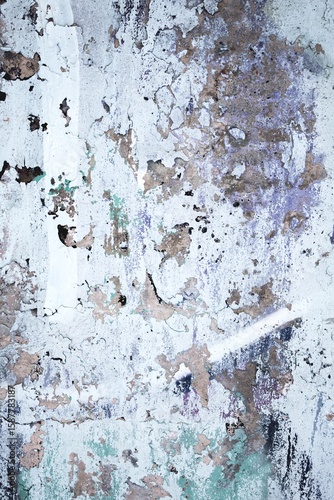 Weathered urban wall texture with rustic vintage look in faded whites, greys, purples. 90s, grunge style, distressed patterns. Backgrounds, digital art, industrial design, grunge aesthetics.