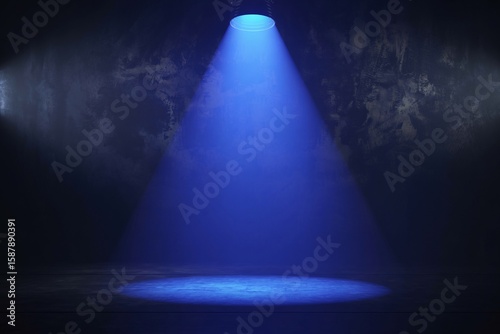 Wallpaper Mural Dramatic studio shot featuring a single vibrant blue spotlight illuminating a dark, textured stage area against a shadowy wall. Torontodigital.ca