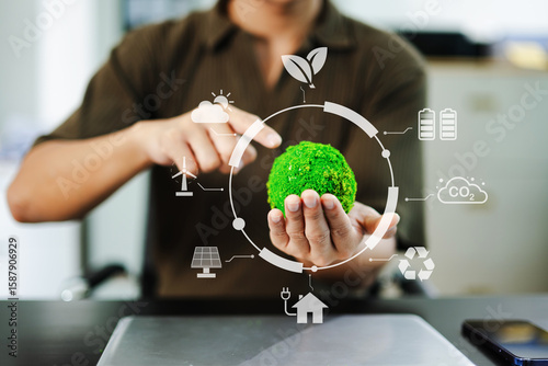 Photos Green earth in hand with futuristic icons shows clean energy, sustainability, an