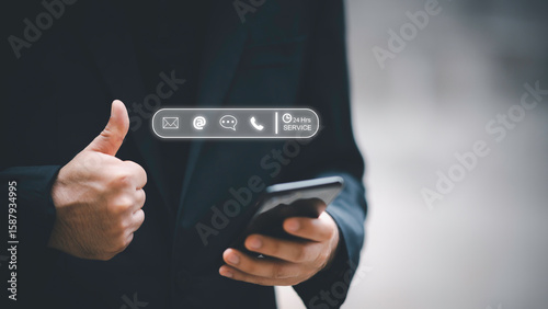 24-7 customer service support concept. Businessman hands holding digital contact icons, including email, phone, and chat, representing communication, accessibility, and online business care.