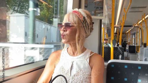 Woman traveling on a metro train in Oslo, Norway