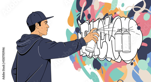 A young man sprays paint on a vibrant graffiti mural.