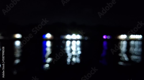 Wallpaper Mural 4K Blurred Light Reflections on Wavy Water Surface at Night – Moody and Cinematic Dark Scene Torontodigital.ca