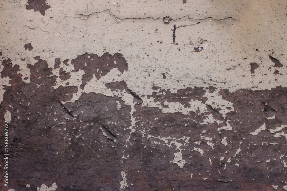 Obraz premium Close Up Of Damaged peeling Wall With Contrasting Light And Dark Textured Areas Indicating Decay