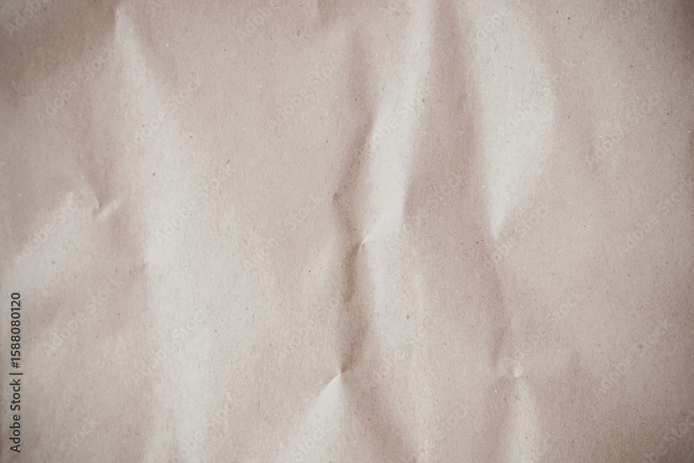 Naklejka premium Crumpled brown paper texture background for design with copy space for text or image. 