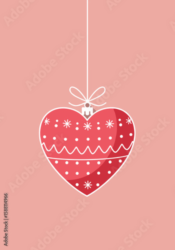 Red decorative heart ornament hanging against soft pink background  