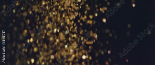 Golden particles falling design element