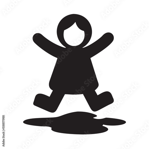 Child with raincoat jumping in muddy puddle