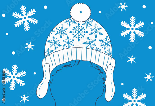 Warm winter hat with snowflakes on blue background  