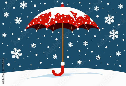 Red umbrella covered in snow on blue winter background  