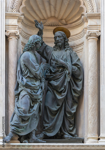 Florence - The bronze statue resurrected Jesus and St. Thomas on the facade of Orsanmichele by Andrea del Verrocchio (1467-1483).