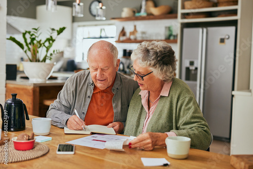 Senior couple managing home finances