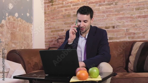 Businessman working from home and making phone calls