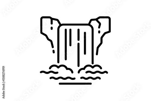 Waterfall rushing between cliffs with mist rising in a natural landscape during daylight hours