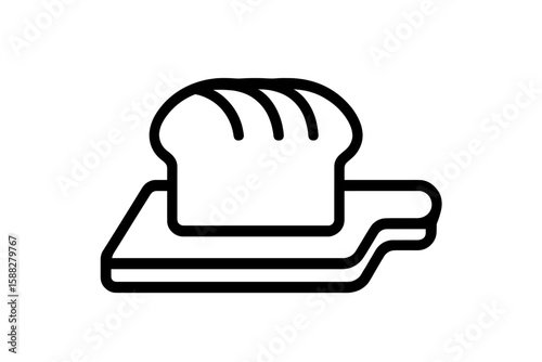Freshly baked bread resting on a wooden cutting board in a cozy kitchen setting