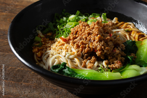 A view of a dan dan noodle bowl.